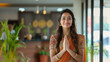 © Artistiao - Beautiful Indian Woman: Smiling and Welcoming with Joined Hands in Namaste at the Reception of a Hotel or Office