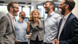 © Axel - Successful group of business people collaborating and laughing in a professional office