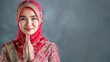 Beautiful indonesian muslim woman greetings gesture typical of ramadan and celebrating eid al-fitr - generative ai