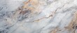 A detailed close-up view of a marble surface, showcasing the intricate patterns and textures of high-resolution Italian marble. The image highlights the smooth and polished surface of the stone,