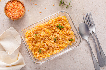Wall Mural - Cooked red lentils in a meal prep container, healthy vegan protein source