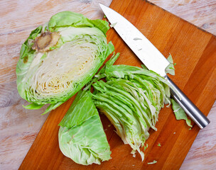 Wall Mural - Sliced fresh cabbage on cutting board. High quality photo