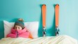 Young woman in bed sleeping with a pair of skis, lady lying with her jacket in her bedroom, longing for her ski vacation, eager to put on her skis and hit the slopes, sweet dreams are made of ski