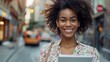 portrait of successful woman using digital tablet in urban background business people concept  wide shot long shot depth of field focuses on the genuine smile 
