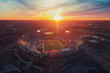 An aerial view of a sports stadium during sunset