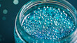 © Justlight - A glass jar filled with water and filled with tiny plastic beads is shown in the sixth image. The beads coated in a hydrophobic substance clump together on the surface of