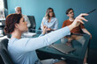 © Jacob Lund - Female professional leading the discussion on a business project in a meeting