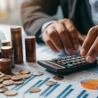 © Hasanul - An accountant working with a calculator, coins, financial report, and an economic growth graph, symbolizing business, finance, investment, and currency exchange.