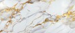 A detailed view of a Carrara statuarietto white marble surface adorned with luxurious gold accents. The intricate pattern and texture of the marble, along with the shimmering gold accents, create a
