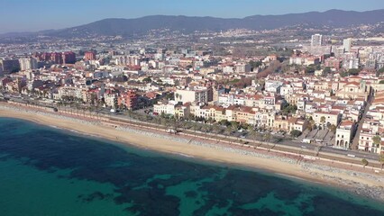 Wall Mural - Aerial view of residential areas and the coast of the small Catalan town of Vilasar de Mar, Spain.