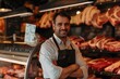 A man stands in front of a meat counter with a smile on his face