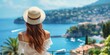 Enjoy a summer vacation in France, with a glimpse of a stylish woman with flowing locks and a sunhat on the beautiful French coast.