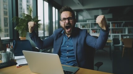 Poster - A man sitting at a desk with a laptop computer. Suitable for business and technology concepts