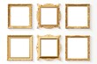 © Fotograf - Set of four elegant gold picture frames on a clean white wall. Perfect for interior design projects