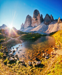 Wall Mural - Nice view of the sunny Lago Rienza - Ursprung in Tre Cime di Lavaredo. Italian Alps, South Tyrol, Europe.