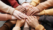 © standret - Multiethnic group of young people putting their hands on top of each other. Close up image of young students making a stack of hands.