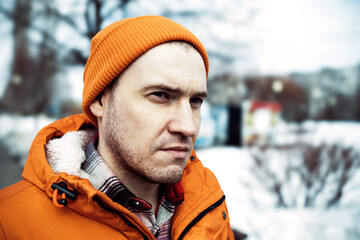 Man Wearing Orange Jacket and Beanie