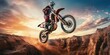 © Viacheslav - motorcycle stunt or car jump. A off road moto cross type motor bike, in mid air during a jump with a dirt trail. Wide format.