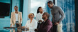 © Jacob Lund - Successful business meeting with happy colleagues collaborating in a professional office