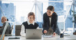 © Gorodenkoff - Professional Female Lawyer and Intern Talking And Working On Laptop Computer In Skyscraper Office In Downtown. Two Caucasian Women Studying New Case in Workspace Of Law Firm With Diverse Colleagues.