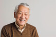 Portrait of old healthy, cheerful handsome Asian senior man smiling and looking at camera with white background. Happy aging society, retirement, teeth, health and senior healthcare concept