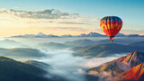 A hot air balloon is flying over foggy mountains high