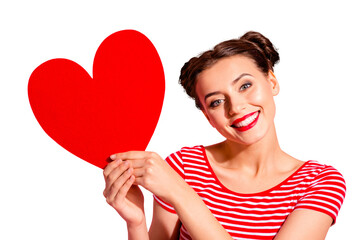 Wall Mural - Close-up portrait of her she nice cute charming attractive lovely lovable cheerful cheery girl wearing striped t-shirt holding in hands showing big large heart isolated over pink pastel background
