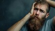 Bearded Young Man Expressing Severe Headache Pain
