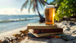 Aesthetic wide angle photograph of a pile of books and a beer pint glass at a tropical beach. Sunlight. Product photography. Advertising. World book day.
