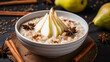 Oatmeal porridge with pear in white plate. Close.