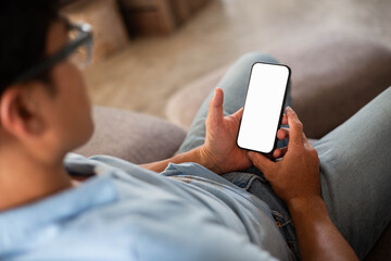 Wall Mural - cell phone blank white screen mockup.hand holding texting using mobile on desk at office.background empty space for advertise.work people contact marketing business,technology