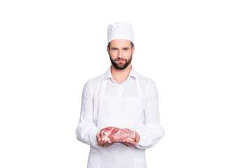 Canvas Print - Portrait with copy space, empty place of handsome attractive butcher demonstrate fresh meat in his arms, looking at camera, isolated on grey background, advertisement concept