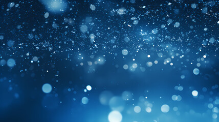 abstract blue background with bokeh lights and falling snowflakes