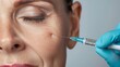 Detail of syringe near a woman's cheek, highlighting beauty injections and dermatological treatments