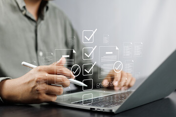 Canvas Print - Business performance monitoring and evaluation concept, Take an assessment, Business man using laptop and tablet online checklist survey, Filling out digital checklist, Questionnaire with checkboxes.