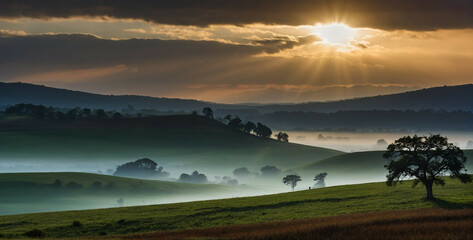 Wall Mural - Sun Shines Through Clouds Over Hills
