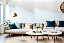 Round white coffee table against white sofa. Scandinavian home interior design of modern living room.