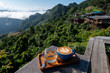 Latte art on wooden table with view point at Jabo village, Mae Hong Son, Thailand
