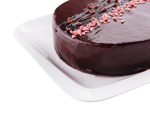 cake on white plate with topping chocolate