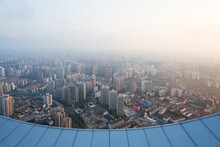 Shanghai In Fog And Edge Of Roof Of Tall Building At Early Morning During Sunrise, View From White Magnolia Plaza
