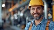 © tonstock - Carpenter with a charming smile poses confidently at his workshop.