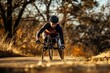Handcyclist surges on autumn trail, epitomizing endurance and the exhilaration of adaptive outdoor sports