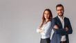© OP38Studio - Business man and woman standing back-to-back with crossed hands against gray background, generative ai