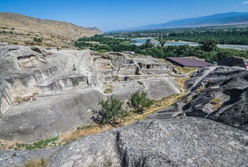 Canvas Print - Aerial view of Uplistsikhe ancient rock-hewn town over Kura river, Georgia