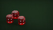 © Jaromír - Playing dice on a green gaming table. Playing a game with dice. Red casino dice rolls.