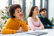 © Prostock-studio - Thoughtful black lady student daydreaming in class