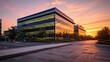 A corporate office exterior at sunset