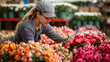 Woman florist tending to rows of vibrant tulips at a flower market. Horticultural expertise and floral business concept. Design for floriculture marketing, flower vending, and horticulturist vocationa