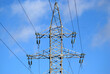 power lines of blue skyTop section of high-voltage power line metal prop on clear blue sky as background