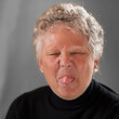Portrait of Woman Sticking Her Tongue Out at the Camera